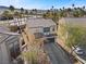 Exterior aerial of a two story stucco home showing desert landscaping, garage and tile roof at 511 Via Ripagrande Ave, Henderson, NV 89011