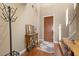 Warm foyer featuring hardwood floors, a stylish console table, and a decorative mirror at 511 Via Ripagrande Ave, Henderson, NV 89011