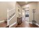 Hallway with wood stairs and trim leads to living area at 511 Via Ripagrande Ave, Henderson, NV 89011