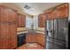 Kitchen with stainless steel appliances, custom cabinetry, breakfast nook, and hardwood flooring at 511 Via Ripagrande Ave, Henderson, NV 89011