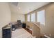 Inviting loft featuring a desk, natural light, and space for work or relaxation on hardwood floors at 511 Via Ripagrande Ave, Henderson, NV 89011