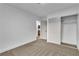 Bright bedroom features neutral carpet, fresh white walls, and a sliding door closet at 528 Sheffield Dr, Henderson, NV 89014