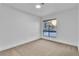 An empty bedroom with carpet and a large window providing lots of natural light at 528 Sheffield Dr, Henderson, NV 89014