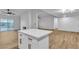 Open kitchen featuring an island with white countertop and modern cabinetry at 528 Sheffield Dr, Henderson, NV 89014