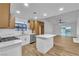 Modern kitchen featuring white cabinets, stainless steel appliances, an island, and an open floor plan at 528 Sheffield Dr, Henderson, NV 89014