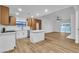 Modern kitchen with white cabinets, stainless steel appliances, and an island for additional counter space at 528 Sheffield Dr, Henderson, NV 89014