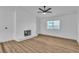 Bright living room with modern flooring, fireplace, and a ceiling fan for a comfortable space at 528 Sheffield Dr, Henderson, NV 89014