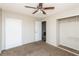 Bedroom with ceiling fan, closet, carpet, and attached bathroom at 557 Liverpool Ave, Henderson, NV 89011