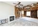 Living room featuring fireplace, tile flooring, and exposed framework at 557 Liverpool Ave, Henderson, NV 89011