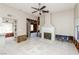 Spacious living room featuring a cozy fireplace and tile flooring at 557 Liverpool Ave, Henderson, NV 89011