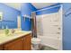 Bathroom featuring a single sink vanity and a shower and bathtub combination at 569 Brompton St, Las Vegas, NV 89178