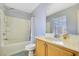 Bathroom features shower-tub combo, light-colored cabinets, and a large mirror at 569 Brompton St, Las Vegas, NV 89178