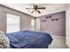 Bedroom with carpet flooring, ceiling fan, and three floating shelves on the wall at 569 Brompton St, Las Vegas, NV 89178