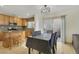 Kitchen dining area with modern light fixture and access to the outdoor patio at 569 Brompton St, Las Vegas, NV 89178