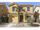 Charming two-story home with a well-maintained front yard, and attached garage at 569 Brompton St, Las Vegas, NV 89178