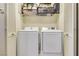 Laundry room featuring a washer and dryer and overhead storage for convenience at 569 Brompton St, Las Vegas, NV 89178