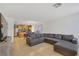 Spacious living room featuring a large sectional sofa and tile flooring at 569 Brompton St, Las Vegas, NV 89178