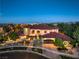 Expansive estate showcasing luxurious architecture, manicured landscaping, and circular driveway at 6 Fire Rock Ct, Las Vegas, NV 89141