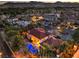 Aerial view of an expansive estate home with a sparkling pool, lush landscaping, and a red tile roof at 6 Fire Rock Ct, Las Vegas, NV 89141