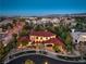 Majestic aerial view of a sprawling estate nestled among lush greenery, showcasing its grand architecture at 6 Fire Rock Ct, Las Vegas, NV 89141