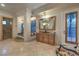 Luxurious bathroom featuring dual vanities, a frameless shower, and backyard views at 6 Fire Rock Ct, Las Vegas, NV 89141