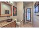 Charming bathroom featuring a vessel sink, granite countertops, and decorative wall art at 6 Fire Rock Ct, Las Vegas, NV 89141