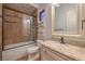 Elegant bathroom with a granite-topped vanity, custom tilework, and walk-in shower at 6 Fire Rock Ct, Las Vegas, NV 89141