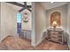 Elegant hallway showcasing a decorative chandelier, arched window, and custom-designed decor at 6 Fire Rock Ct, Las Vegas, NV 89141