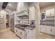 Kitchen showcasing stainless appliances, a professional-grade range, and beautiful tile backsplash at 6 Fire Rock Ct, Las Vegas, NV 89141