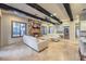 Inviting living room with a stone fireplace, wood beams, and comfortable seating at 6 Fire Rock Ct, Las Vegas, NV 89141