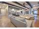 Bright and airy living room with exposed beam ceilings, tile floors, and seamless kitchen access at 6 Fire Rock Ct, Las Vegas, NV 89141