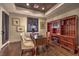 Elegant home office featuring wood floors, a wooden accent ceiling, and built-in bookcase at 6 Fire Rock Ct, Las Vegas, NV 89141