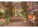 Outdoor patio area with a fireplace and views into the dining room at 6 Fire Rock Ct, Las Vegas, NV 89141