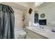 Bathroom with shower and tub combination, tile, vanity and mirror at 6202 La Palma Pkwy, Las Vegas, NV 89118