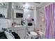 Bathroom with tile walls, shower-tub combo, and a single sink vanity at 6202 La Palma Pkwy, Las Vegas, NV 89118