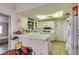 Functional kitchen features white cabinets, tile floors and plenty of counter space at 6202 La Palma Pkwy, Las Vegas, NV 89118