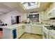 Functional kitchen features white appliances, tile floors and plenty of counter space at 6202 La Palma Pkwy, Las Vegas, NV 89118