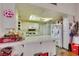 Bright kitchen featuring white cabinets and tile countertops at 6202 La Palma Pkwy, Las Vegas, NV 89118