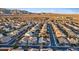 Aerial view of a well-planned community with houses, streets, and mountain views in the background at 6944 Puetollano Dr, North Las Vegas, NV 89084