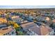 Aerial view of a residential community showcasing homes, streets, and greenery in a well-organized neighborhood at 6944 Puetollano Dr, North Las Vegas, NV 89084