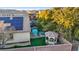 Overhead shot revealing a home's backyard oasis with a gazebo, pool and solar panels on the roof at 6944 Puetollano Dr, North Las Vegas, NV 89084