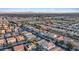 Scenic aerial view of neighborhood homes and streets, offering a glimpse of community living and city skyline at 6944 Puetollano Dr, North Las Vegas, NV 89084