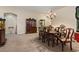 Dining area with elegant chandelier and wooden table, perfect for Gathering gatherings at 6944 Puetollano Dr, North Las Vegas, NV 89084