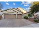 Charming single-story home with desert landscaping, two-car garage, and brick paved driveway at 6944 Puetollano Dr, North Las Vegas, NV 89084