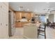 Bright kitchen with stainless steel appliances, granite countertops, and center island at 6944 Puetollano Dr, North Las Vegas, NV 89084