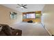 Spacious living room featuring a large movie screen and neutral carpet flooring at 6944 Puetollano Dr, North Las Vegas, NV 89084