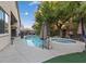 Gorgeous backyard pool and spa area with mature landscaping, perfect for outdoor living and entertaining at 6944 Puetollano Dr, North Las Vegas, NV 89084