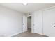 Neutral bedroom with carpet and white sliding-door closet at 7176 Southpark Ct, Las Vegas, NV 89147