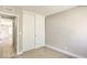 Bedroom with carpet flooring, neutral walls, and double door closet at 7176 Southpark Ct, Las Vegas, NV 89147