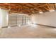 Spacious two-car garage featuring ample space for vehicles and storage at 7176 Southpark Ct, Las Vegas, NV 89147